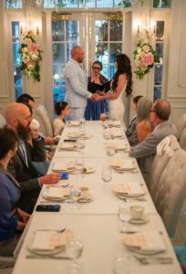 Micro wedding at The Cake Back Shop at Disney's Boardwalk officiated by Karen Hooper