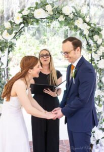 Private backyard poolside ceremony in Florida with family officiated by Once Upon 2 Rings